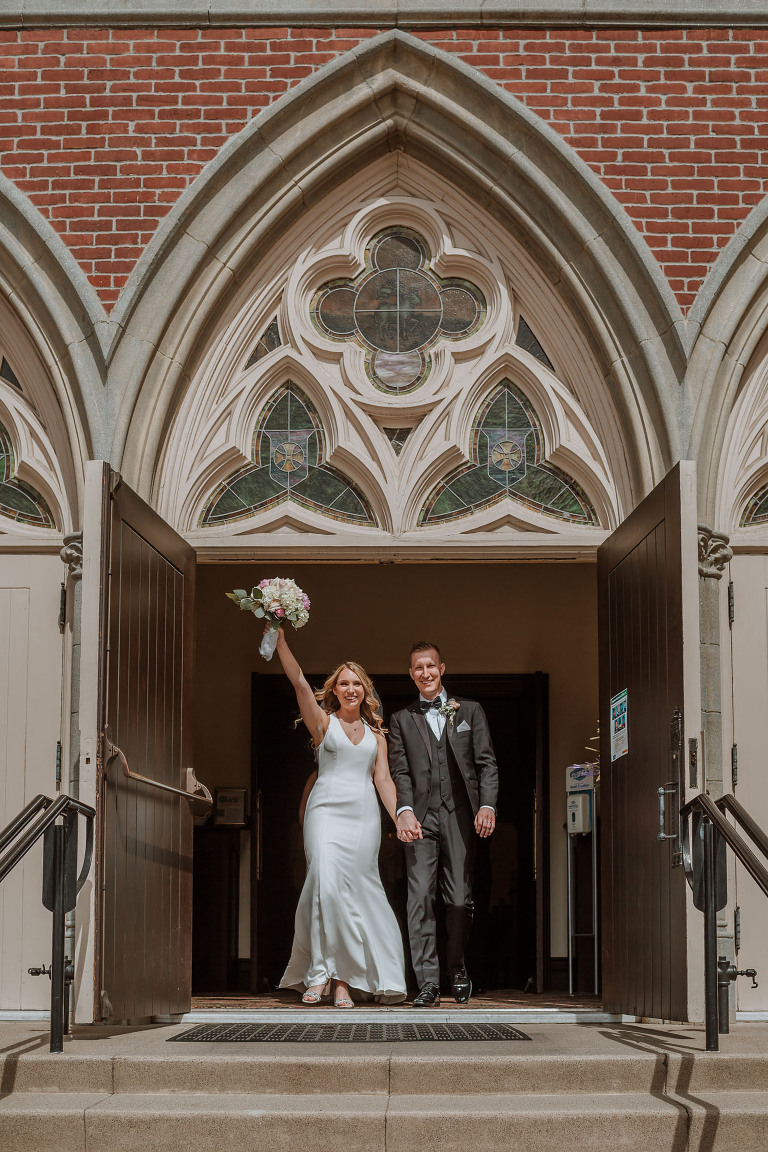 bride and groom at st. johns lutheran church in orange wedding