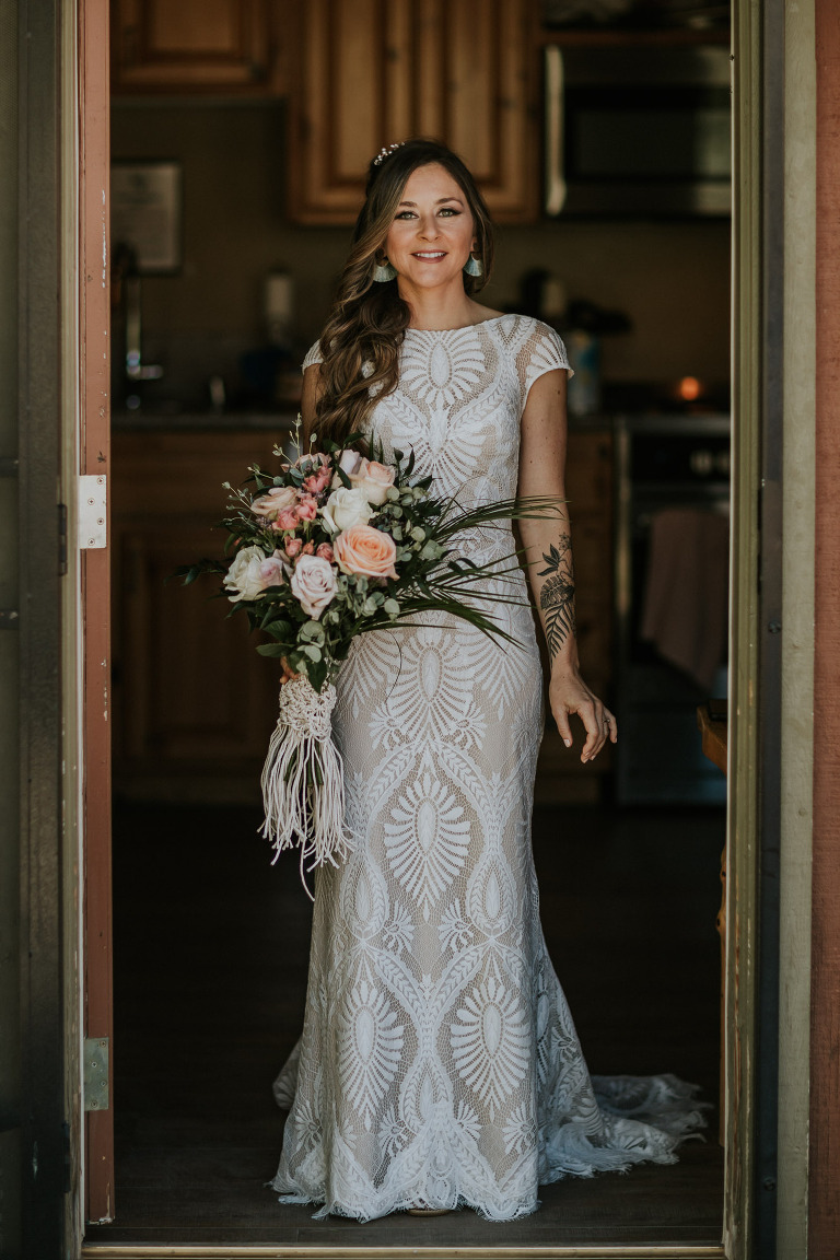 bride in a lace BHLND dress