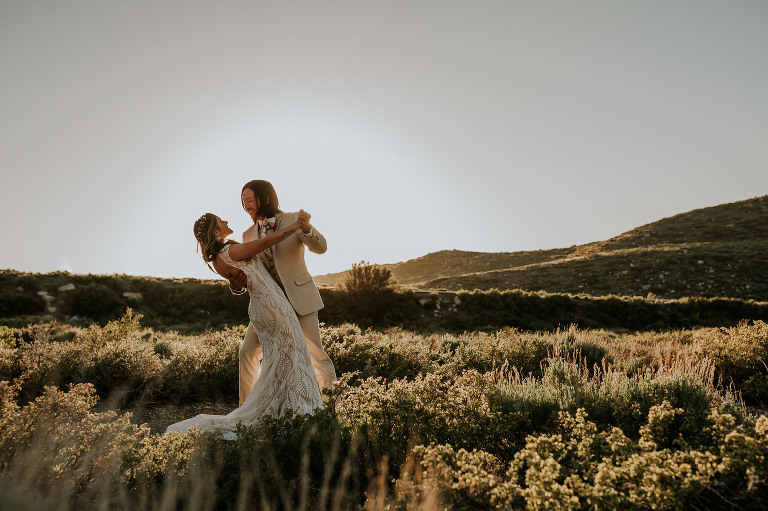 bride and groom dip at golden hour in mammoth lakes