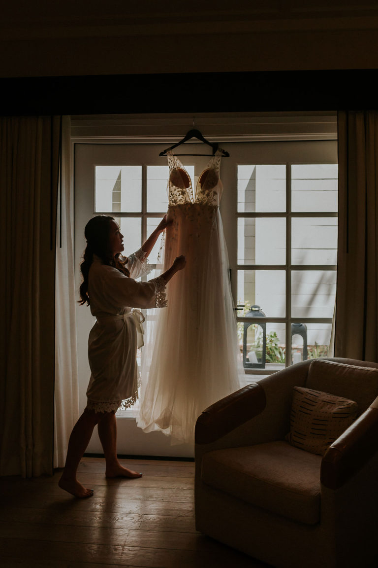Sonoma bride looking at hanging dress