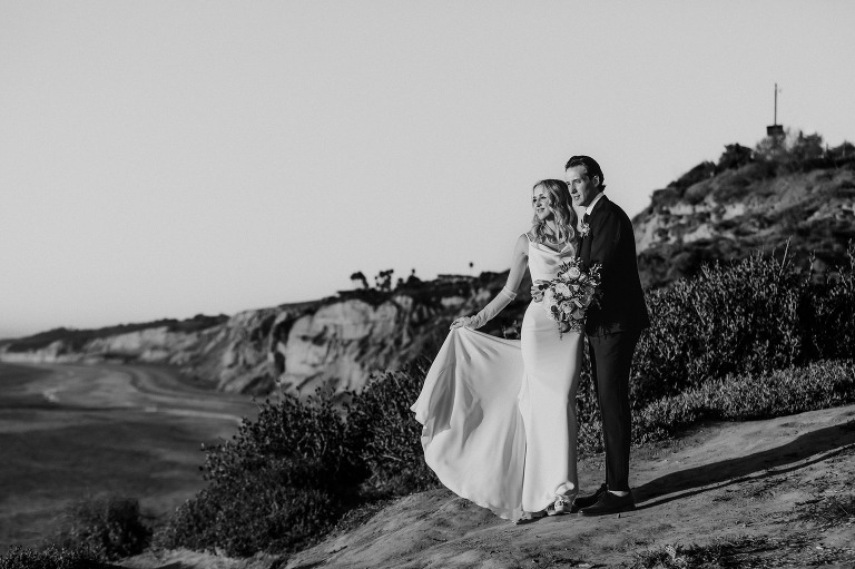 couple gazing at the ocean view at martin johnson house wedding venue