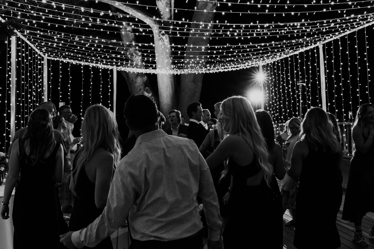 a packed dance floor under light canopy at Martin johnson house wedding venue