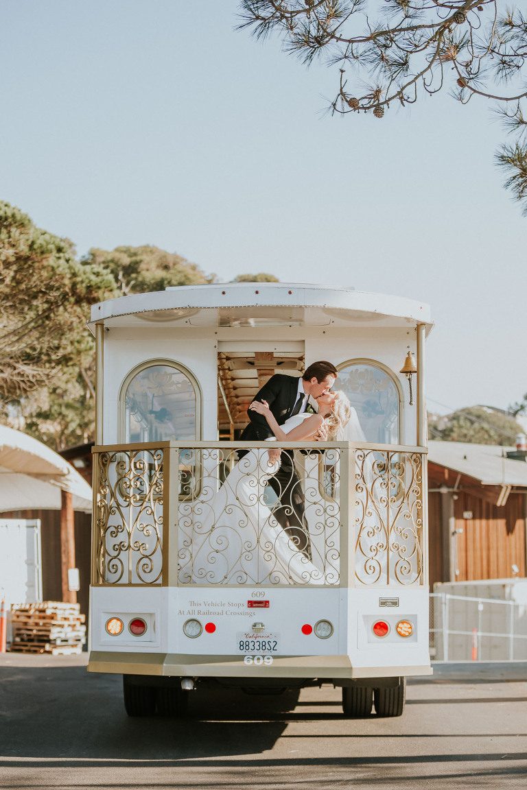 Couple kissing on the San Diego trolley at Martin Johnson House wedding