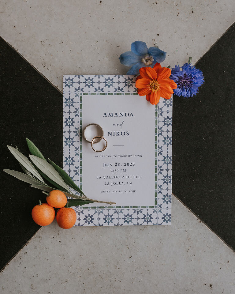 wedding invitation with florals and kumquats
