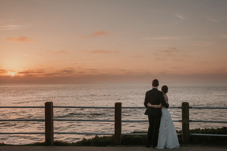 bride and groom taking n the sunset at la valencia wedding
